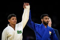 | Photo: AP/Aurelien Morissard : Paris Paralympics 2024: Kapil Parmar, right, celebrates after winning the Para Judo - Men -60 kg J1 Bronze Medal